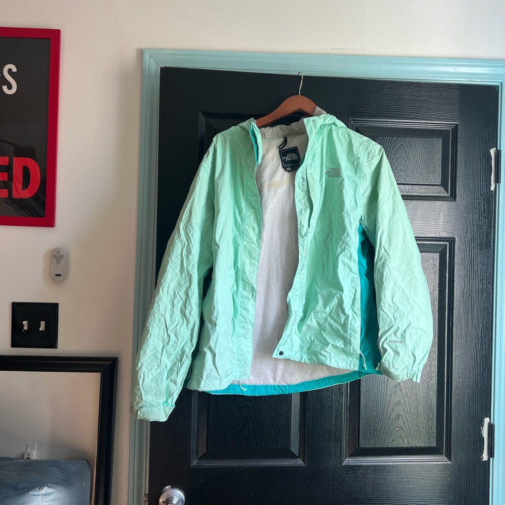 Mint blue north face rain jacket